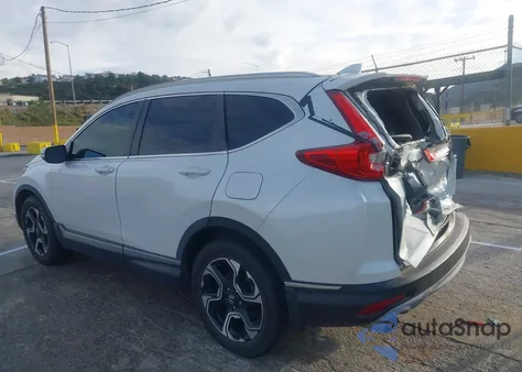 2019 Honda Cr-V Touring z USA, uszkodzony, nr VIN 7FARW1H90KE003990